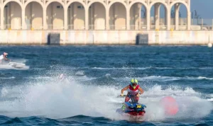 Estelle Poret on a charge in Qatar.