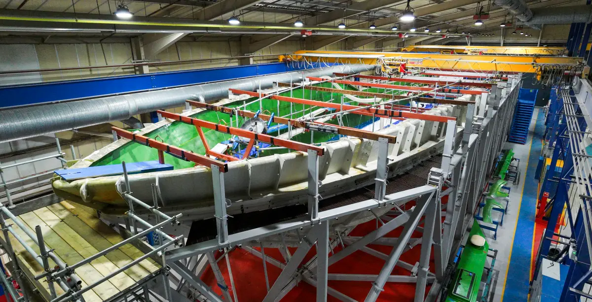 The first hull lamination ceremony for the Sunseeker 134 Superyacht at Osprey Quay, Dorset