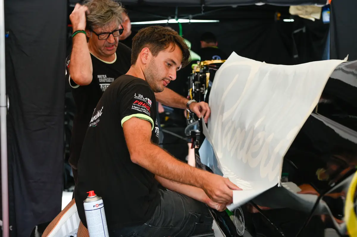 Alberto Comparato and Massimo Roggiero in the Comparato F1 Team tent