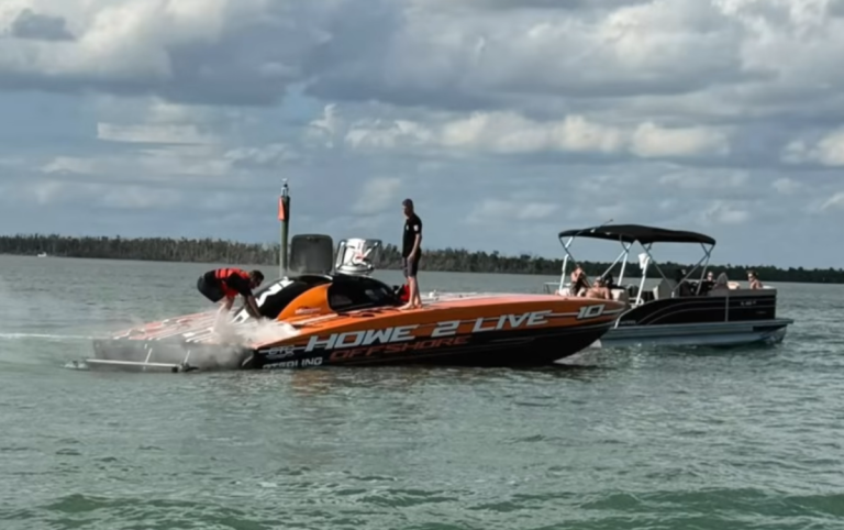 Mike Howe's Skater 388 race boat with flames coming from the engine vents during testing in Fort Myers, 2026
