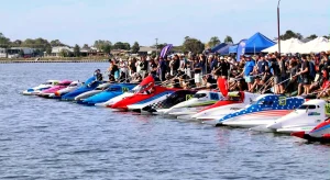 GP formula tunnel boats lined up on the dock at the Australian Formula Powerboat Grand Prix, Yarrawonga 2026 - 15-boat field including Sam Lucas, Rhys Coles and Will Parker