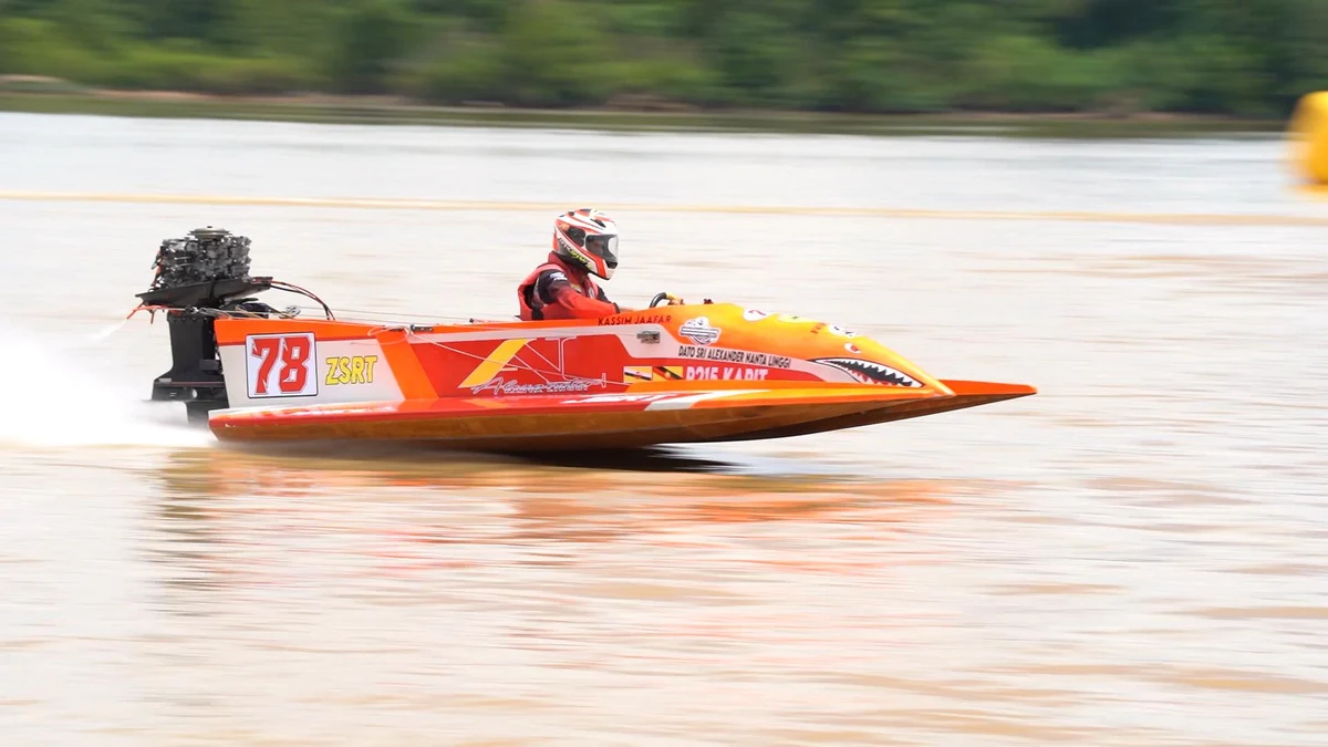 ZSRT boat number 78 driven by Kassim Jaafar at full speed on the Rajang River during the 2025 Sibu International Powerboat Race