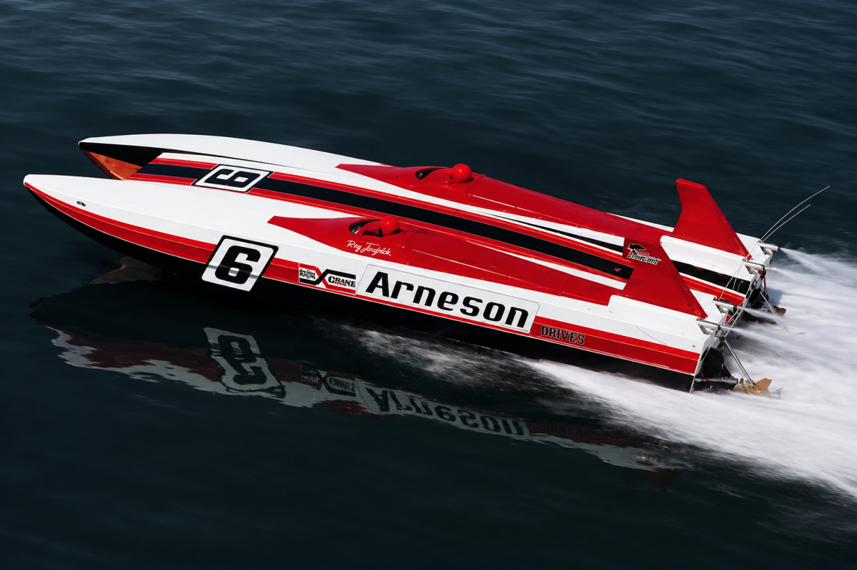 Arneson Drives-sponsored offshore racing catamaran at speed, fitted with Arneson surface drives and Rolla propellers