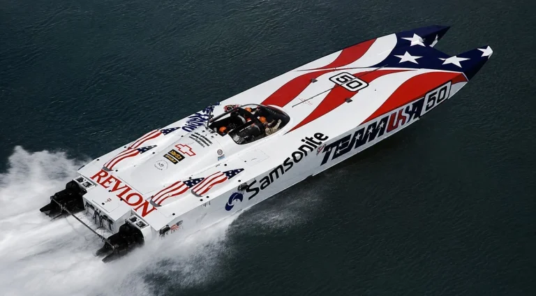 Don Johnson's Team USA catamaran number 50 racing at speed, Samsonite and Revlon sponsorship, 1989