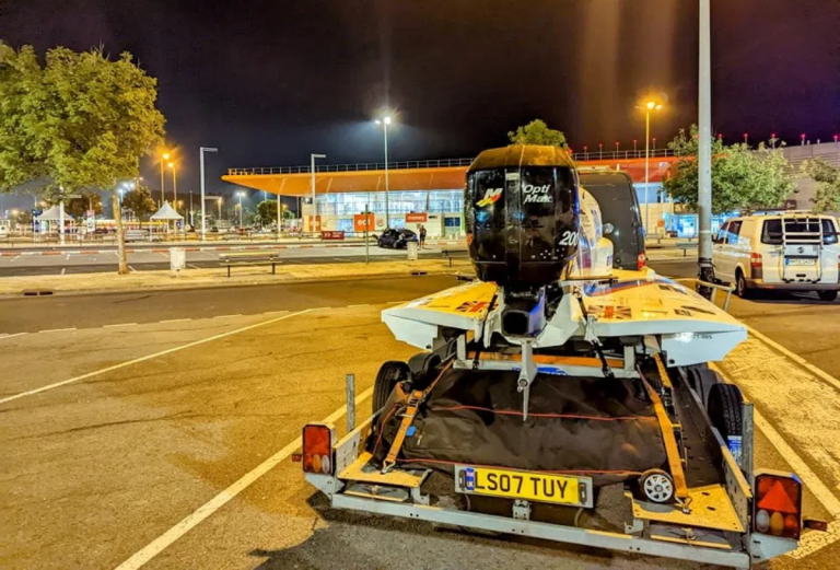 Powerboat on trailer at Calais Eurotunnel terminal at night - spare fuel and jerry can rules for cross-channel crossings
