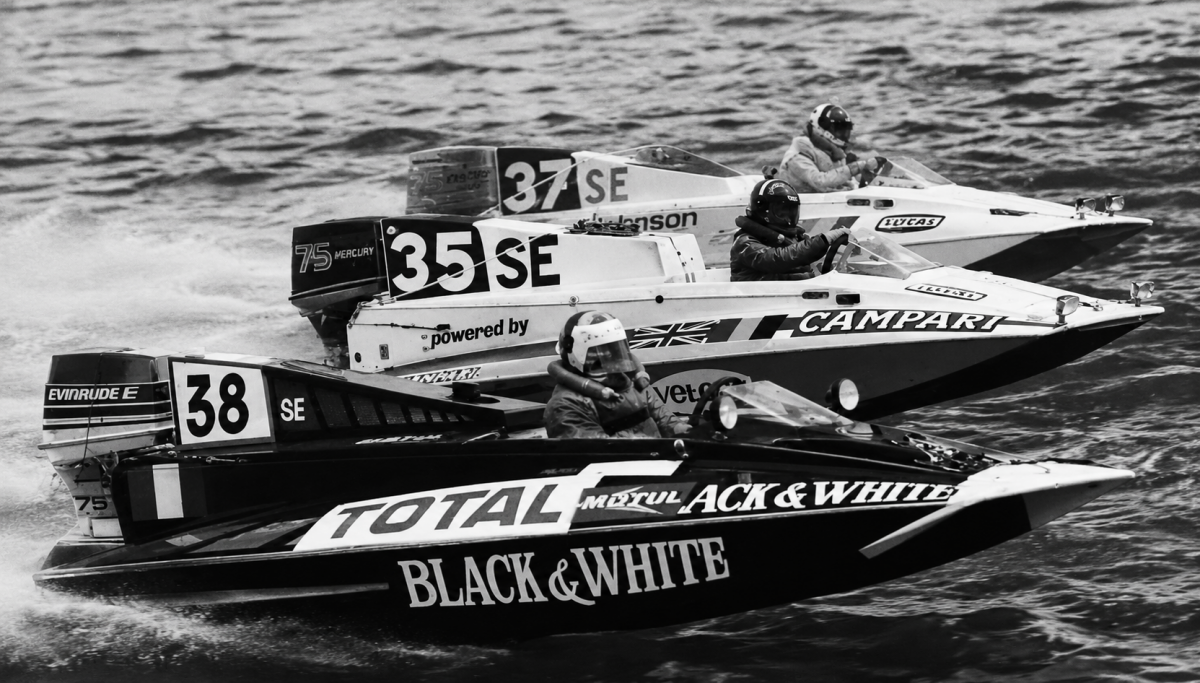 French entry number 38 driven by Guy Touron overtakes the all-girl team number 35 and Alan Langdon number 37 during the seventh hour of the 1976 Rouen 24 Hours on the Seine