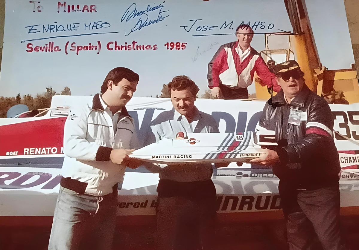 Renato Molinari holds an AMPS scale replica of his Martini Racing boat number 18, Seville Christmas 1985