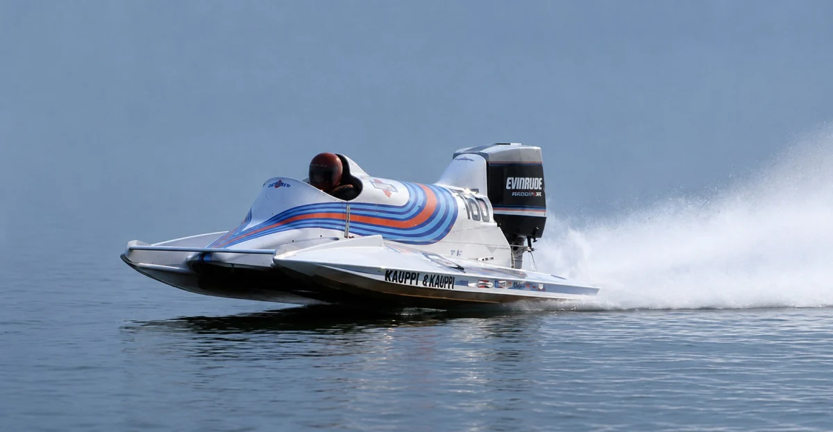 Martini-liveried F1 powerboat number 100 with Evinrude outboard at speed