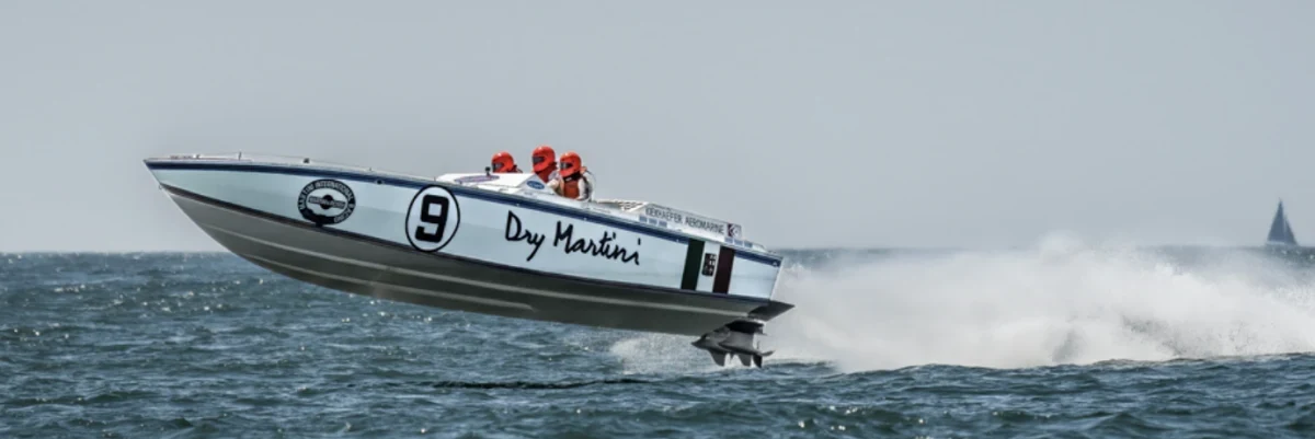 Dry Martini powerboat number 9 airborne at the Round the Island Race 2023, photographed by Rob Clifford