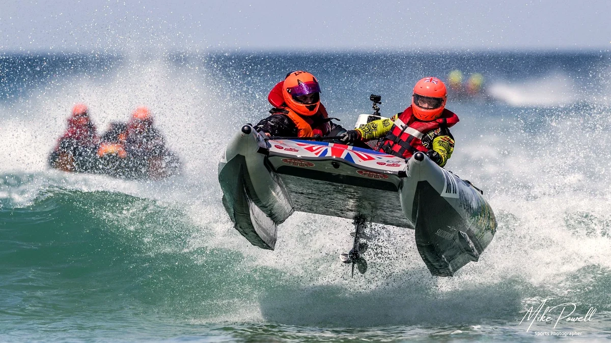 ThunderCat inflatable catamaran airborne in surf racing action, Cornwall UK. Photo: Mike Powell