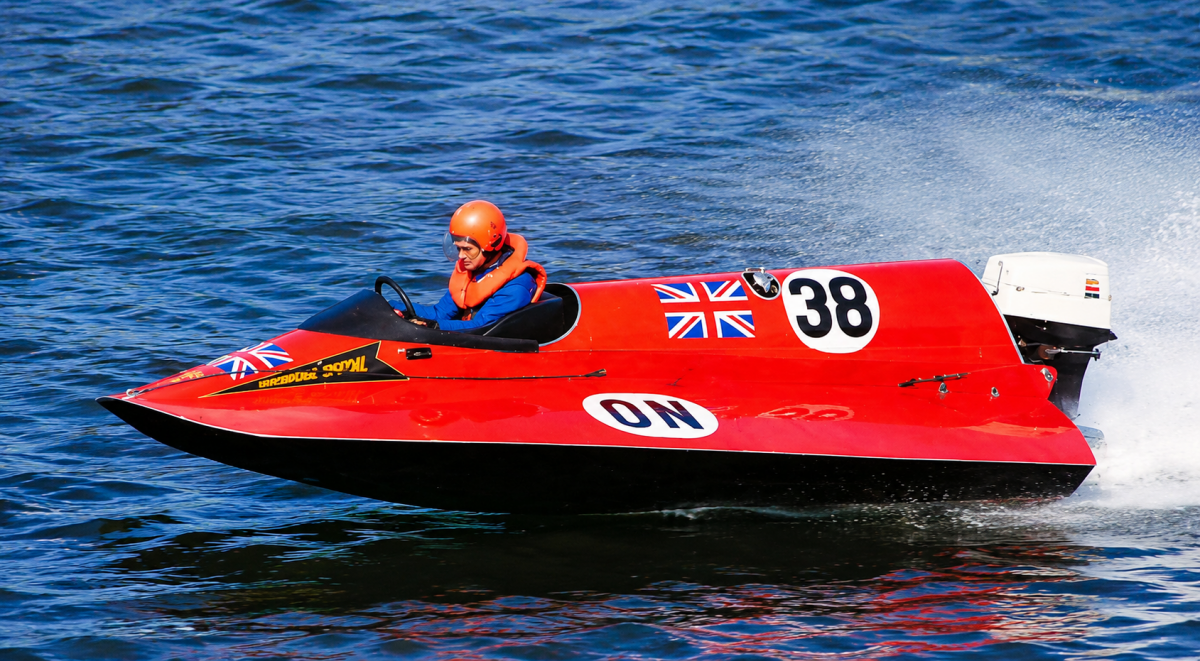 Bill Shakespeare racing his red ON class powerboat number 38 on Lake Windermere, circa 1970