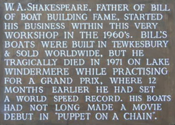Heritage plaque on the original Shakespeare boatyard on the Back of Avon, Tewkesbury, commemorating W.A. Shakespeare and his son Bill Shakespeare the powerboat racer