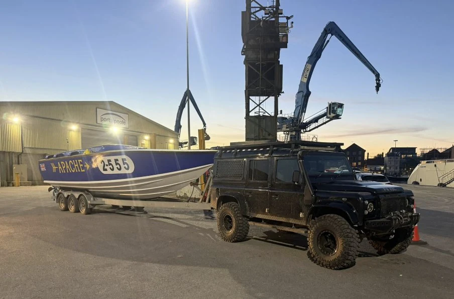 Apache 555 on her trailer at Port of Poole at dusk after recovery from the 2026 Poole Bay 100