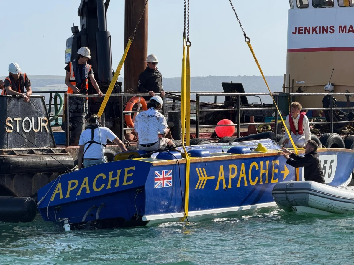 Apache 555 being lifted by crane from the Jenkins Marine barge Stour after sinking at the 2026 Poole Bay 100