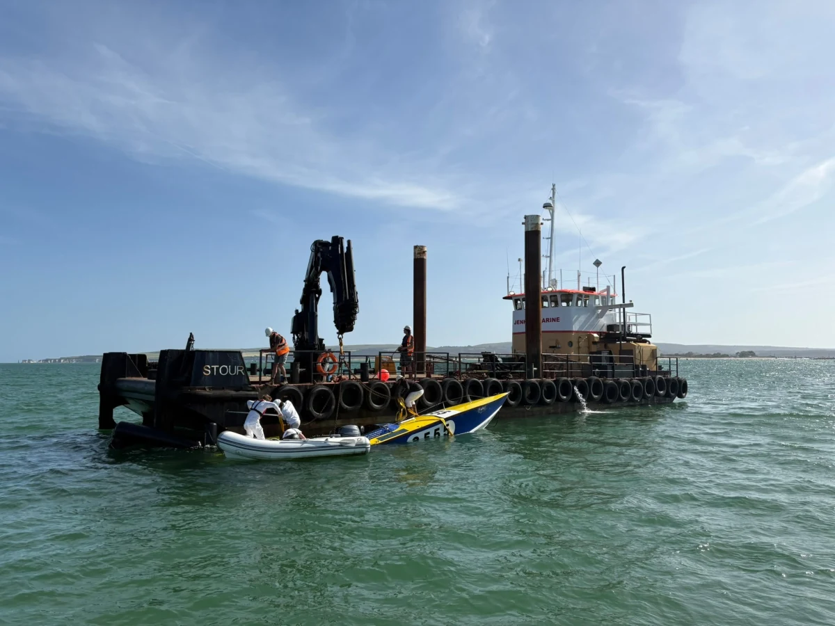 Apache 555 alongside the Jenkins Marine barge Stour during recovery at the 2026 Poole Bay 100