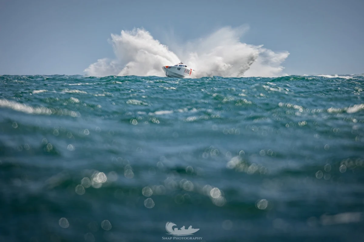 Gary Aldington's boat launches off a wave during UKOPRA offshore racing