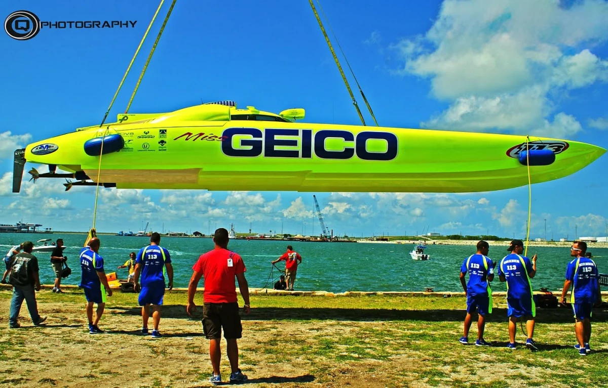 Miss GEICO Mystic Powerboats catamaran being craned into the water