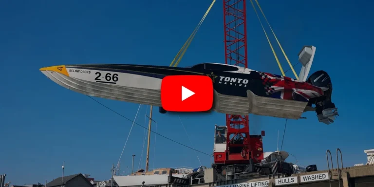 66 Racing's Berserk hangs from the crane at Torquay ahead of her first outboard-powered sea trial