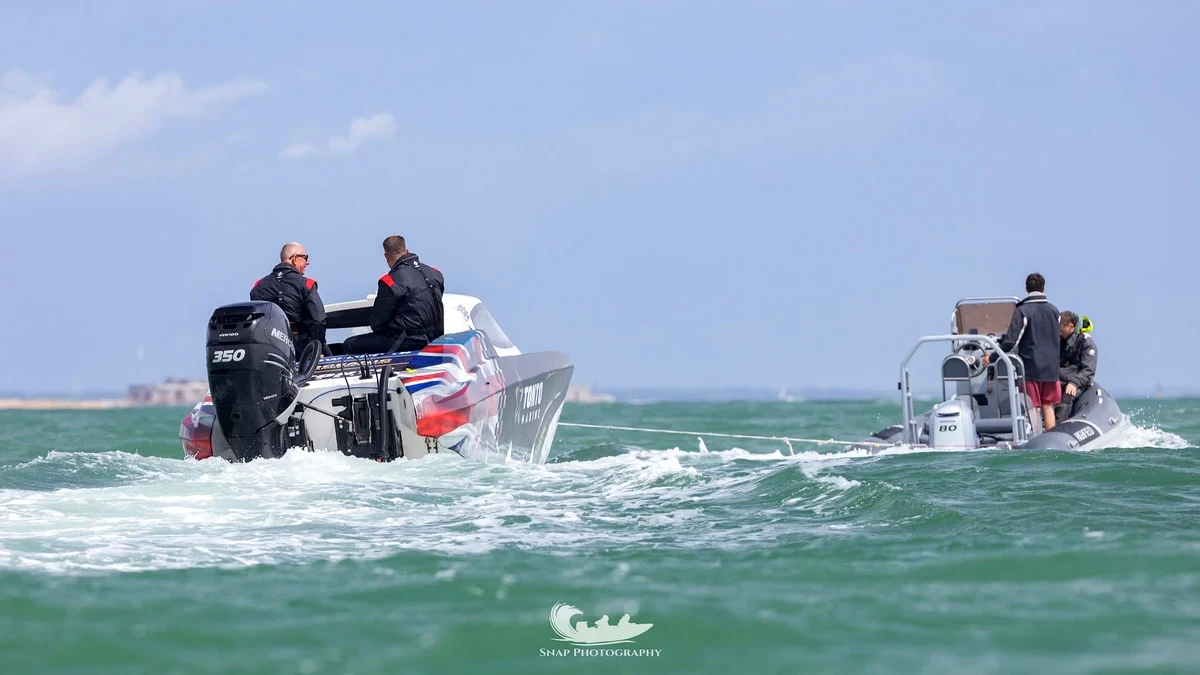 Berserk under tow after retiring from the Round the Island race with engine failure