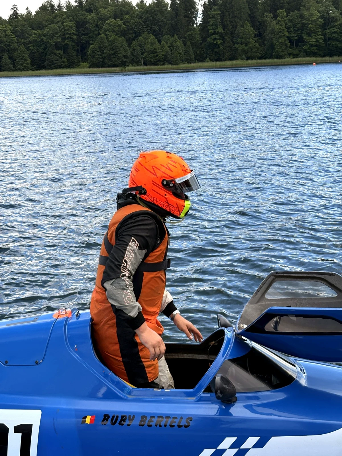 Buby Bertels climbs out of the cockpit of his tunnel hull at Lake Alūksne