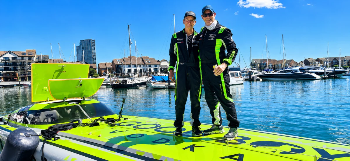 Rob Lockyer and Adrian de Ferrenti stand on the deck of Good Boy Vodka at Ocean Village Marina after winning Class 1 at the MDL Marinas Ocean Village Cup