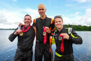 Nils Slakteris, Adam Wrenkler and Attila Horvath celebrate on the podium at the 2026 UIM F4 European Championship at Aluksne