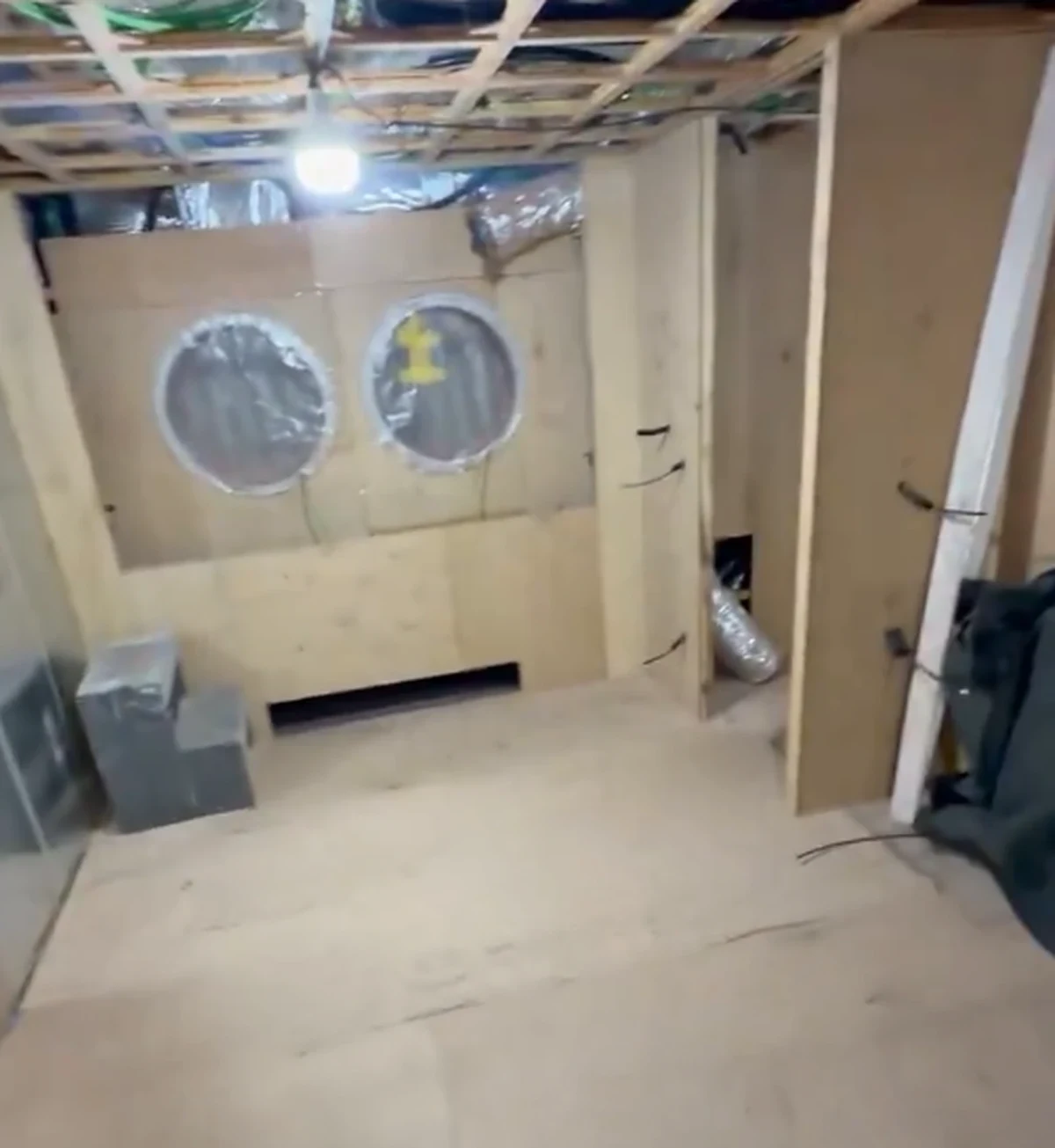 A cabin under construction on the Obsidian Blade superyacht showing two circular portholes, below deck at Aegean Yacht