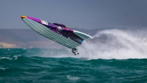 Rush Racing UK E-16 offshore powerboat airborne over a wave at UKOPRA Round 4, the MDL Marinas Mercury Offshore Grand Prix 2026