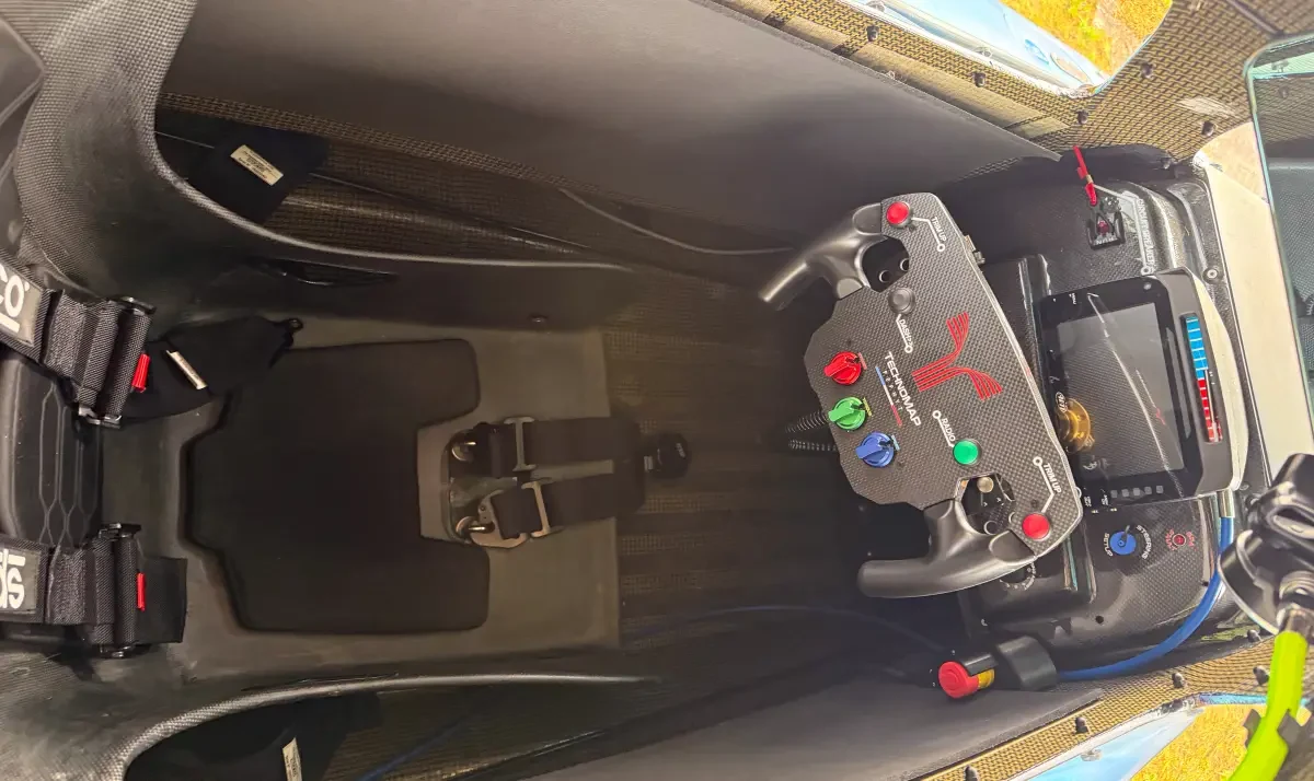 TechnoMAP PePHyT cockpit overhead view showing control panel, display screen and Sparco harness