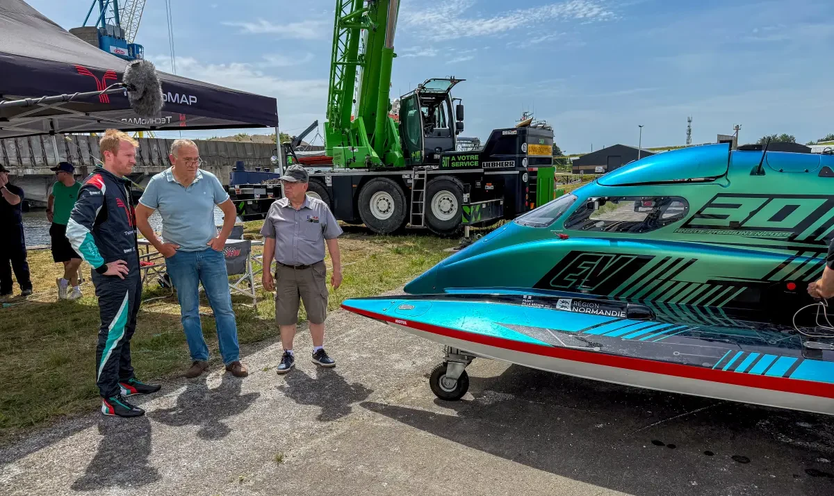 TechnoMAP team members alongside the PePHyT electric hydroplane at the Canal de Caen, May 2026