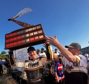 Andrew Tate lifts the Apollo Mechanical Cup trophy with the BWR Racing team at Seafair 2026