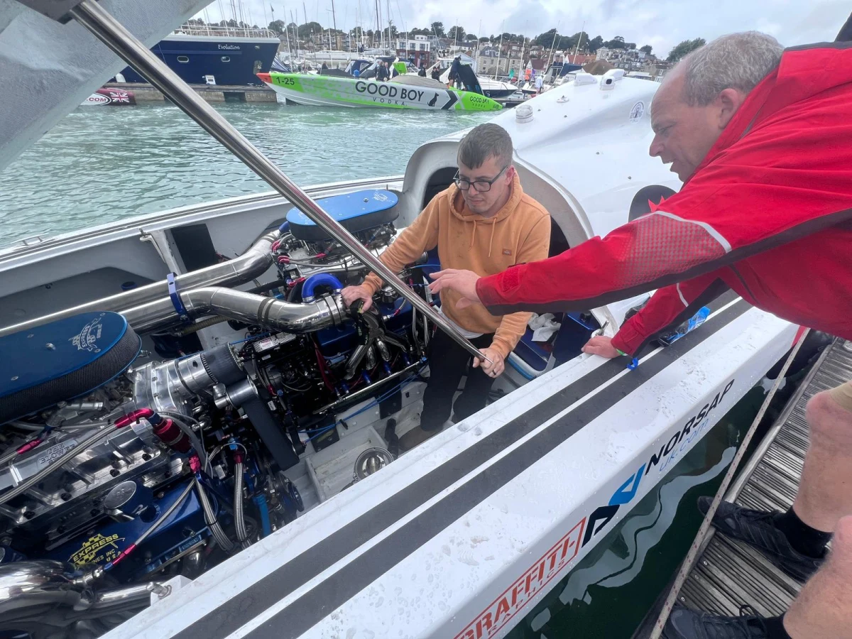 Gary Aldington's crew fit a replacement supercharger belt spline to Double Trouble's engine at Cowes Yacht Haven ahead of the Cowes Torquay Cowes 2026