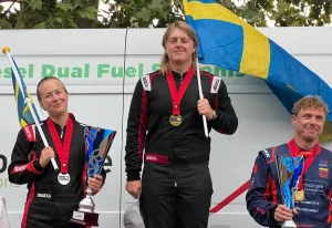 Hilmer Wiberg celebrates winning the 2026 UIM F2 European Championship on the podium at Viverone, with runner-up Mathilda Wiberg and third placed Edgaras Riabko