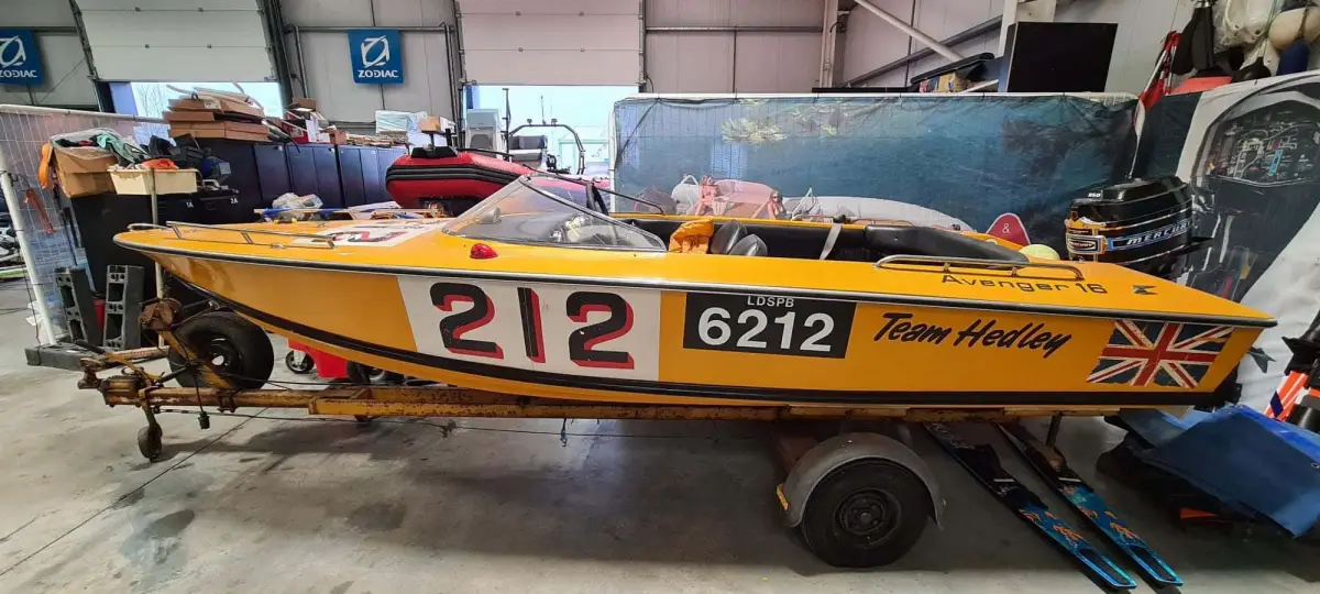 A restored Avenger 16 powerboat in yellow Team Hedley livery