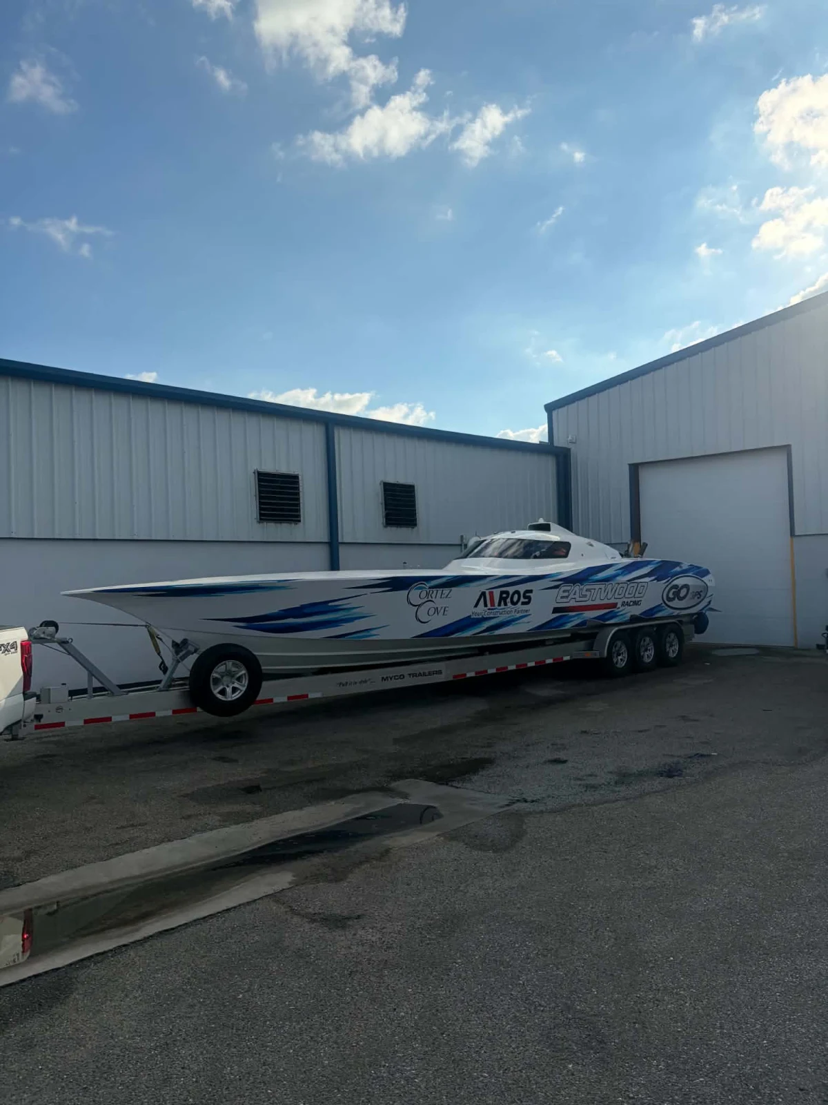 Go GPS Racing's Fountain Super Vee on its trailer outside a workshop, ready to tow
