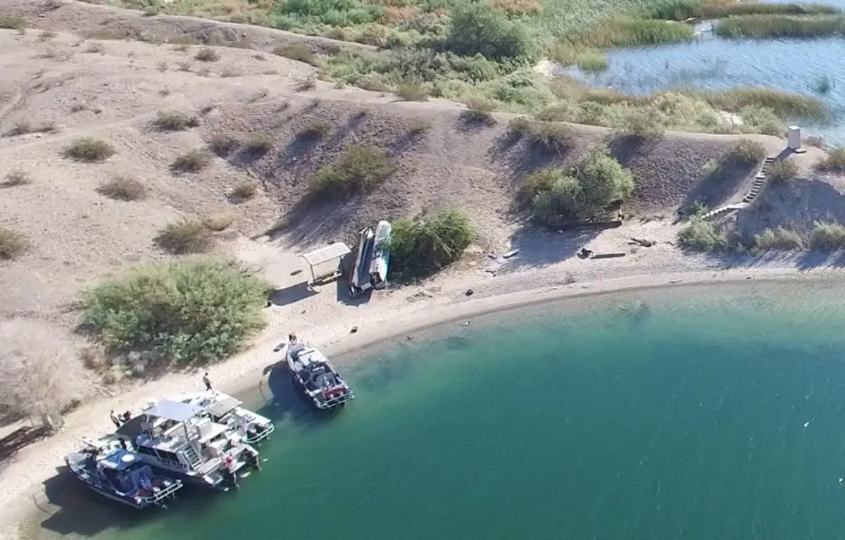 Aerial view of the overturned boat in a Lake Havasu campsite after the fatal crash near Cattail Cove State Park
