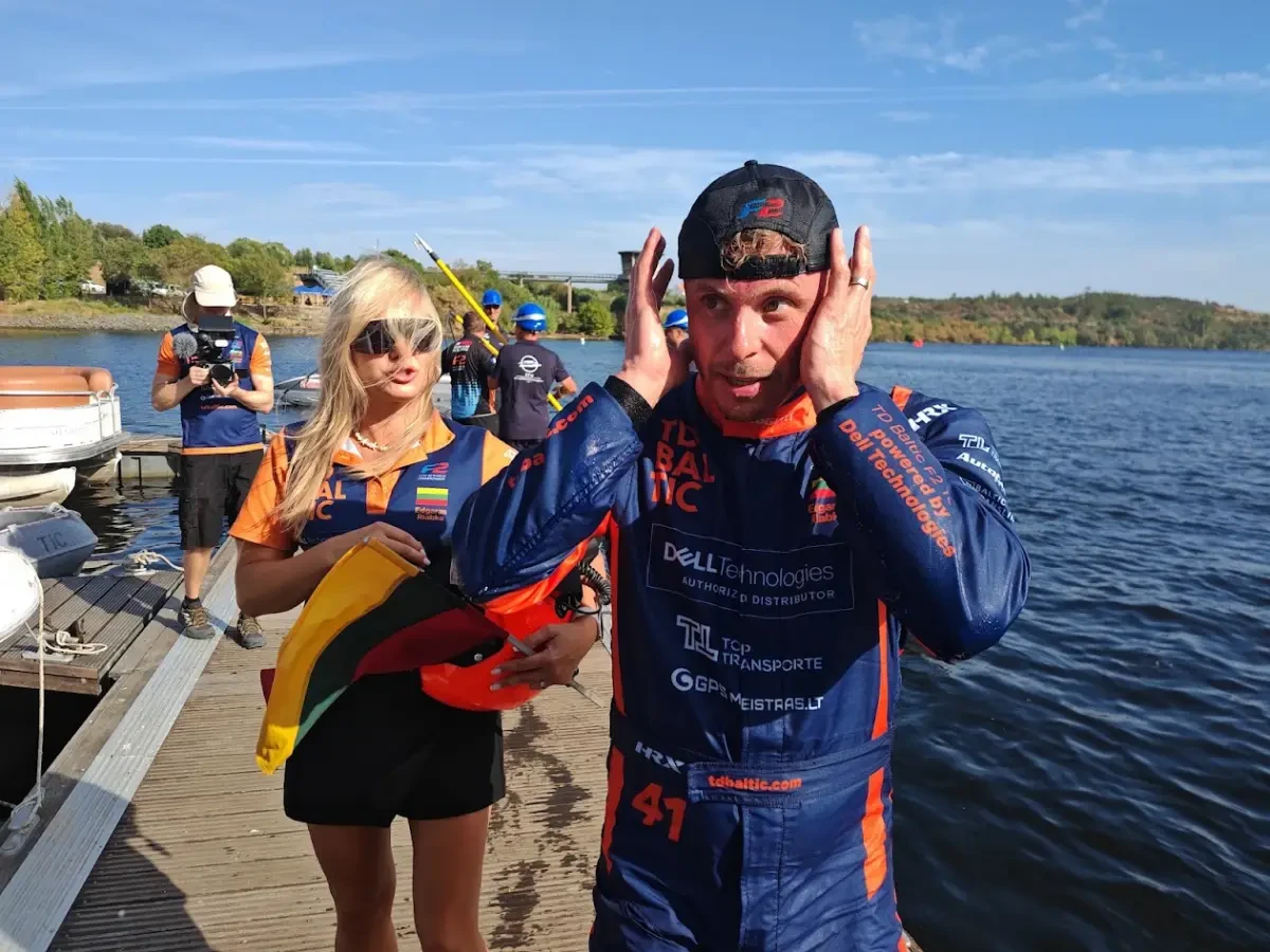 Edgaras Riabko celebrating with the Lithuanian flag after being crowned 2026 UIM F2 World Champion at Vila Velha de Ródão