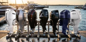 Seven 200hp outboards from Hidea, Honda, Mercury Racing, Parsun, Suzuki, Tohatsu and Yamaha lined up on a marina dock