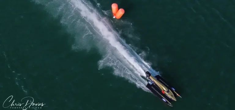 Aerial view of Adam Wrenkler's UIM F4 boat racing past a turning buoy
