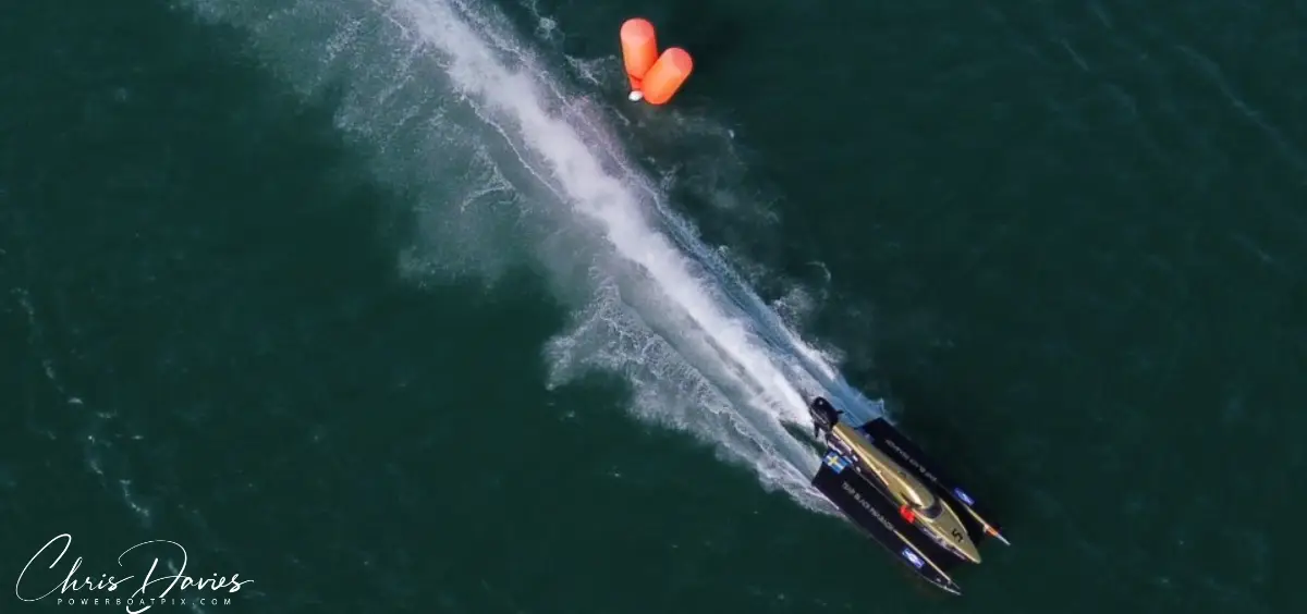 Aerial view of Adam Wrenkler's UIM F4 boat racing past a turning buoy