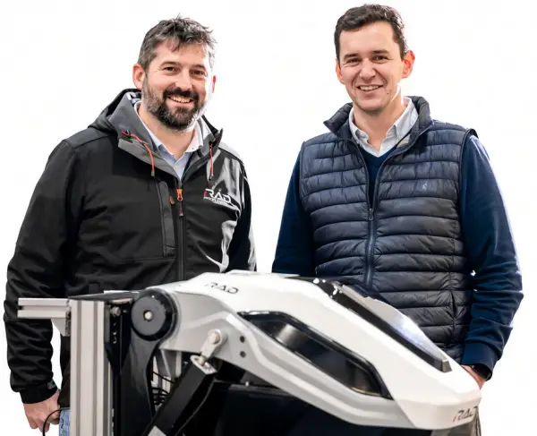 RAD Propulsion co-founders Dan Hook and Rich Daltry standing behind a RAD electric outboard
