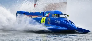 Alec Weckström's blue Victory Team F1H2O boat 3 throws up spray at speed