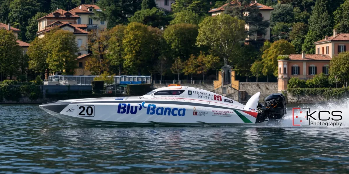 Blu Banca, number 20, the XCat of Serafino Barlesi and Joakim Kumlin, racing on Lake Como at the 2026 Centomiglia del Lario
