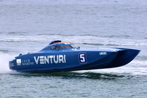 Club Marine Venturi, the blue 36-foot Supercat Extreme catamaran of Antony de Fina and Matt Kelly, racing at speed in Club Marine livery