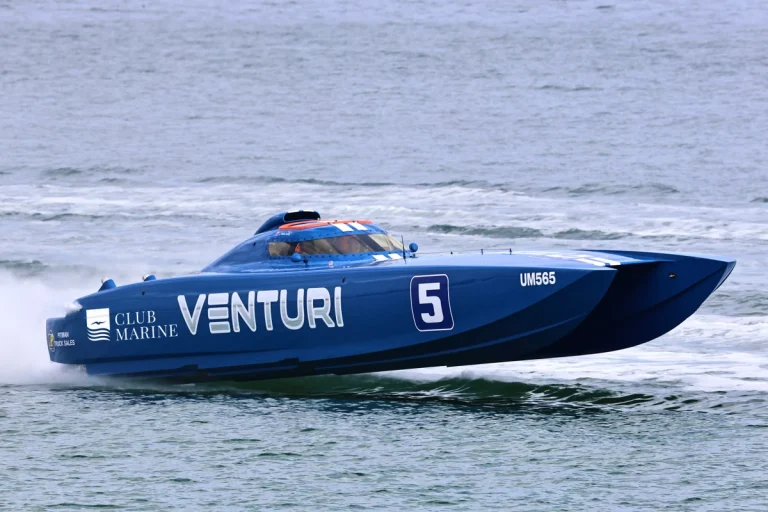 Club Marine Venturi, the blue 36-foot Supercat Extreme catamaran of Antony de Fina and Matt Kelly, racing at speed in Club Marine livery