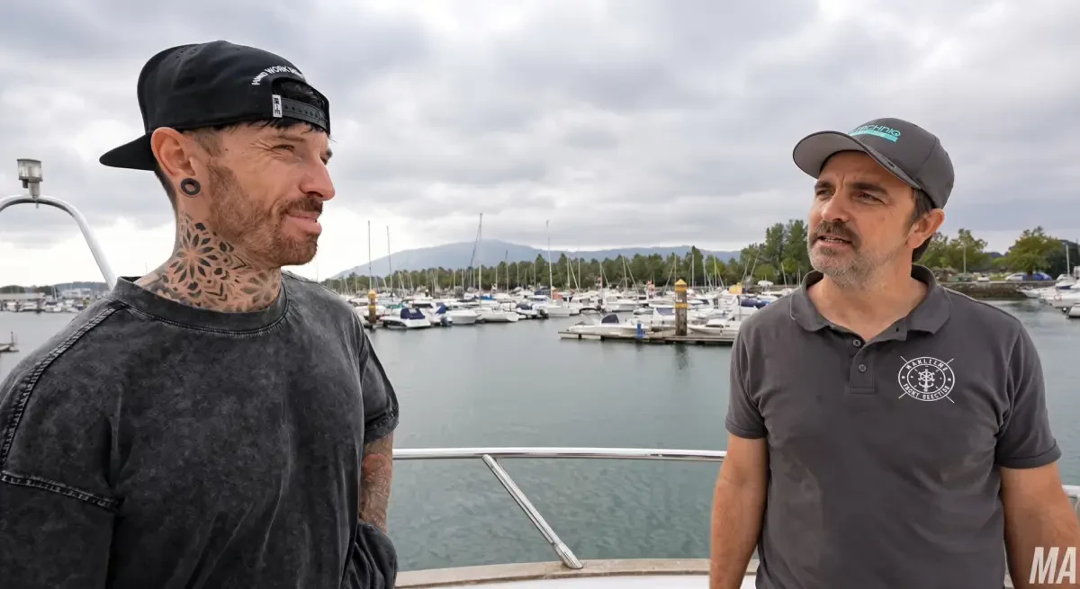 James Tapp of Maritime Yacht Services talking with YouTuber Mat Armstrong aboard the yacht Capri in a Spanish marina