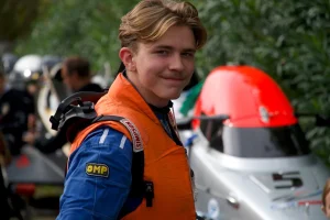 Finnish powerboat driver Oliver Martin in his race suit and life jacket in the pits