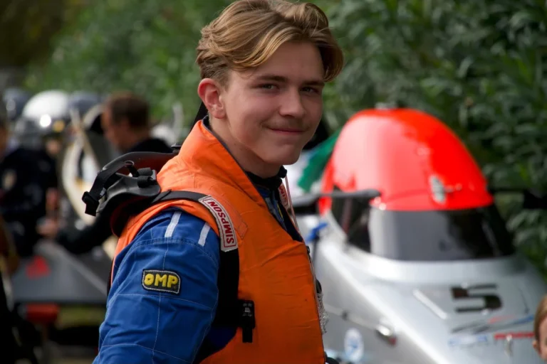 Finnish powerboat driver Oliver Martin in his race suit and life jacket in the pits