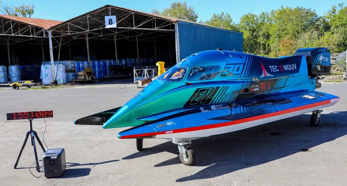 PePHyT electric hydroplane on its trailer beside the timing display at Caen, September 2026