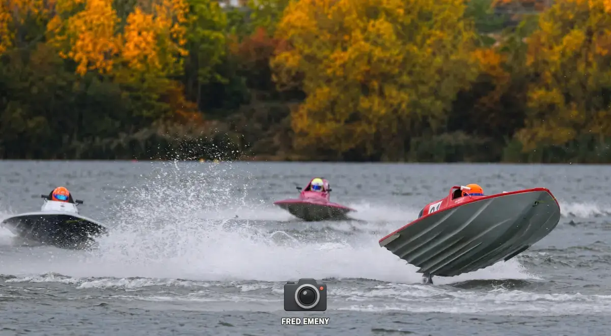 Three GT15 boats racing on Stewartby Lake at the 2026 British Masters finals, with autumn trees behind